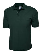 Dark green short-sleeve polo shirt with a ribbed collar, three-button placket, and ribbed cuffs. Regular fit.