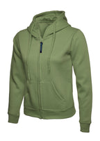 Olive green women's zip-up hoodie with front pockets, drawstring hood, and ribbed cuffs. Fitted silhouette.