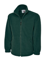 Dark green, full-zip fleece jacket with a high collar, elastic cuffs, and two front zippered pockets. Regular fit.