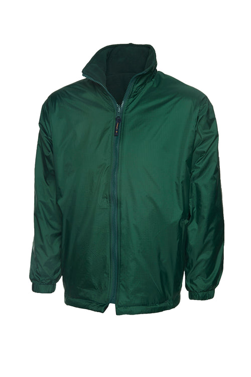 Dark green zip-up reversible jacket with a high collar, long sleeves, elastic cuffs, and a regular fit.
