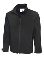 Black softshell jacket with a high collar, full-length zip, chest pocket, and adjustable velcro cuffs. Regular fit.