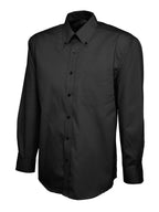 Black button-down long-sleeve shirt with a button-down collar, front placket, and a single chest pocket. Regular fit.