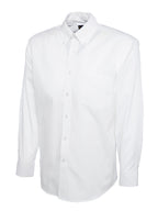 White long-sleeve button-down shirt with a collar, button-down front, and chest pocket. Regular fit.