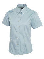 Light blue button-up shirt with short sleeves, a button-down collar, and a tailored, fitted silhouette.