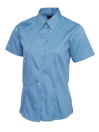 Light blue women's short-sleeve button-down shirt with a button-down collar and tailored fit.