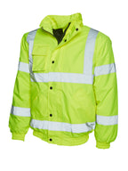 High-visibility yellow safety bomber jacket with reflective stripes, zip-and-snap closure, chest pocket, and ribbed hem.