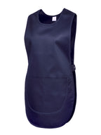 Navy blue tabard apron with a scoop neck, side snap closures, and a large front patch pocket.