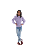 Girl wearing a light purple crewneck sweatshirt with long sleeves and a relaxed fit, paired with slim-fit blue jeans.